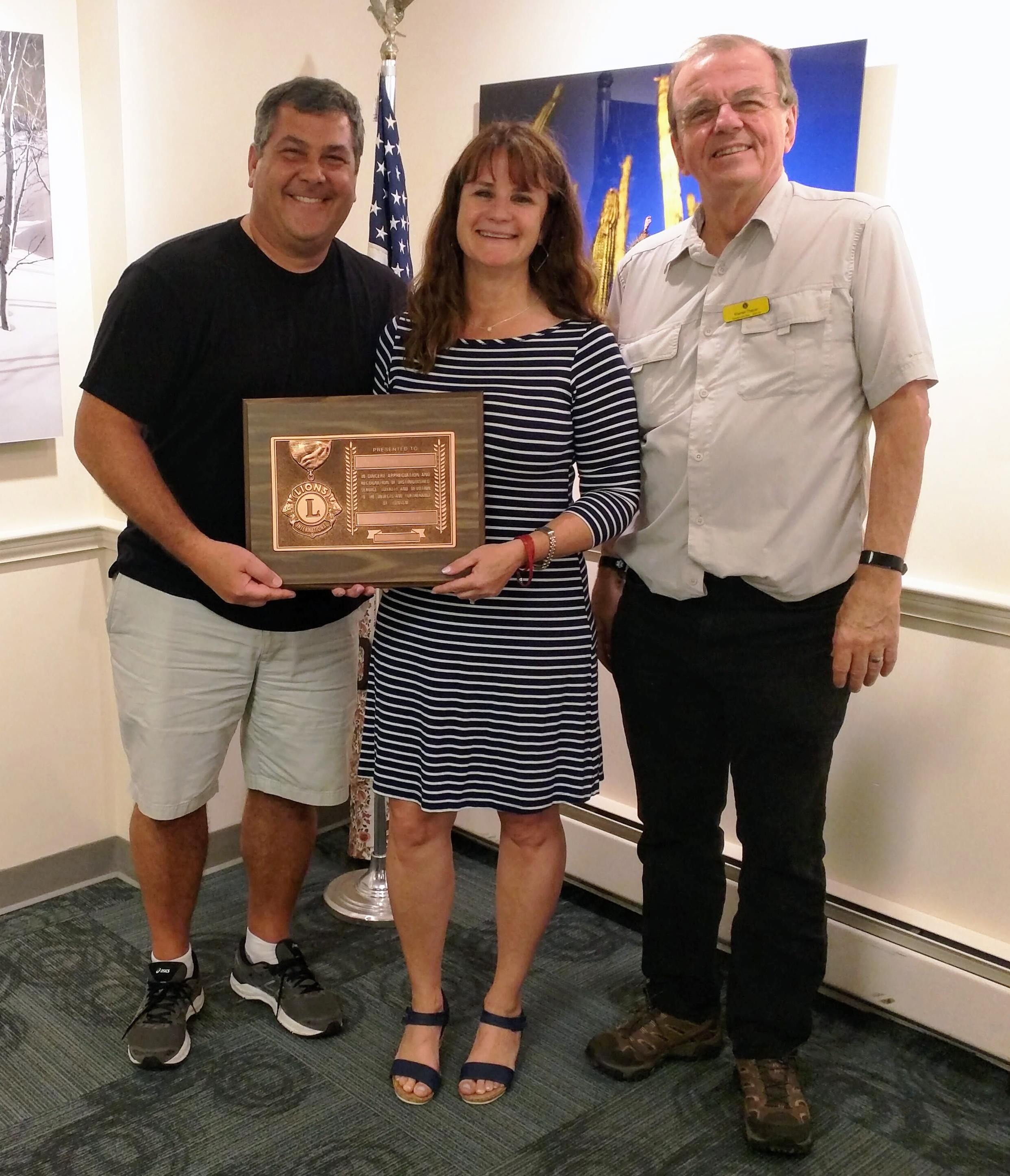 From left, Lions Rob and Laurie Sabatelle, and Norwich King Lion Warren Thayer