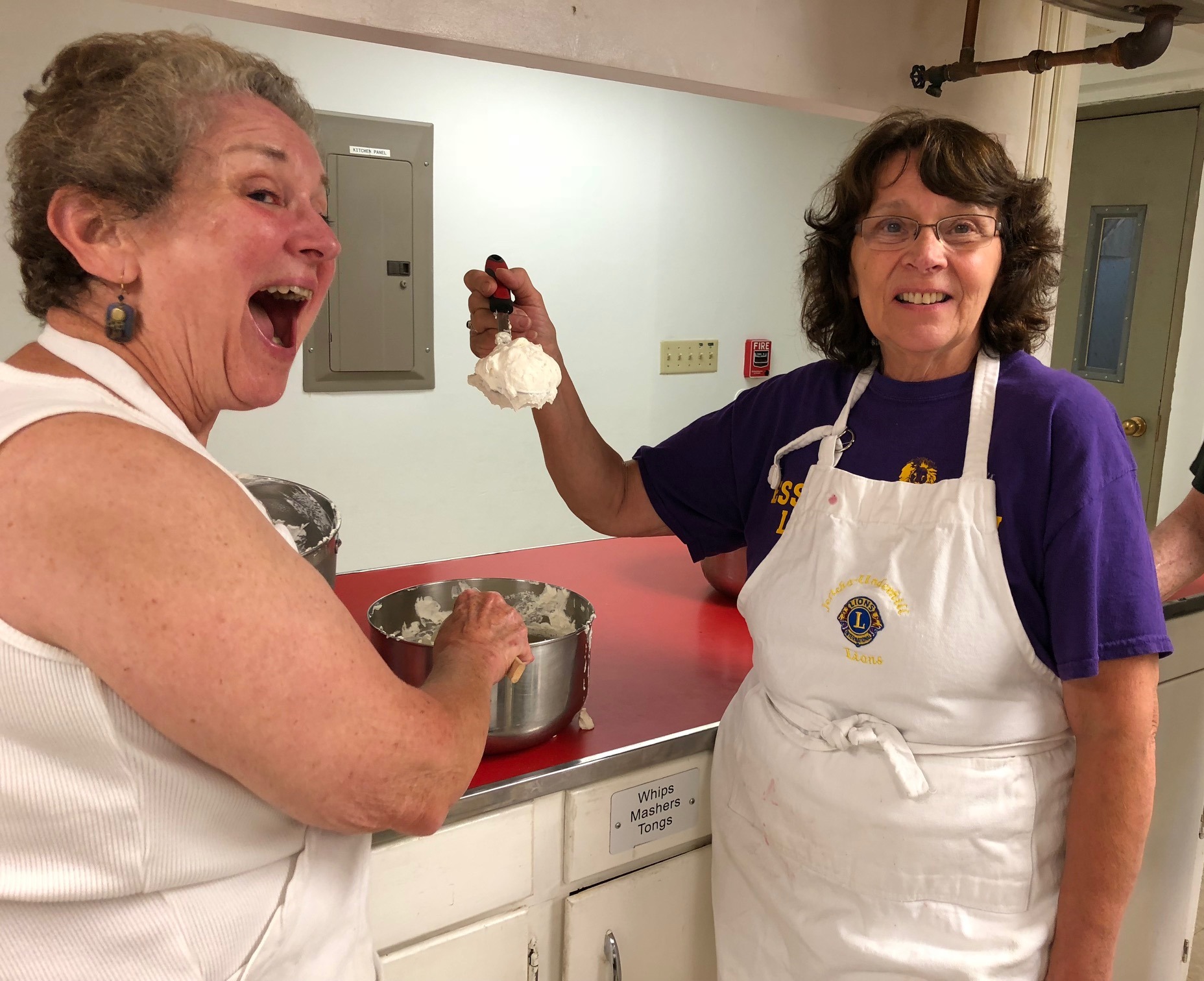 Marge Alden and Betsy MaGee prepare for taste test